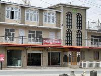 a large building with a sign that reads signal lodge at Skardu Lodge in Skardu