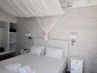 Posteľ alebo postele v izbe v ubytovaní Casa Bianca