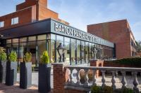 Un edificio con un cartel en el frente. en Barton Manor Hotel &amp; Spa; BW Signature Collection, en Preston