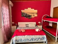 A bed or beds in a room at Marzamemi Da Giusy