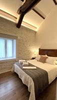 Posteľ alebo postele v izbe v ubytovaní Apartamentos Minas de Silvarosa