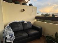 A seating area at Arenal Golf Apartment