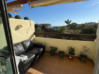 A balcony or terrace at Arenal Golf Apartment
