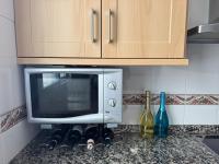 A kitchen or kitchenette at Arenal Golf Apartment