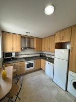 A kitchen or kitchenette at Arenal Golf Apartment