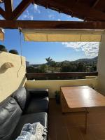 A seating area at Arenal Golf Apartment
