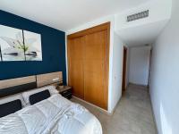 A bed or beds in a room at Arenal Golf Apartment