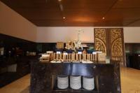 a table with plates on it in a restaurant at Ananta Spa & Resort Jaipur in Jaipur