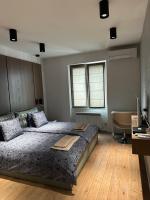 Postel nebo postele na pokoji v ubytování Apartment Rotonda