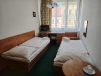 Postel nebo postele na pokoji v ubytování Hotel Legie