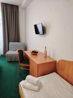 Postel nebo postele na pokoji v ubytování Hotel Legie