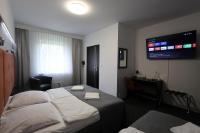 Łóżko lub łóżka w pokoju w obiekcie Hotel Junior