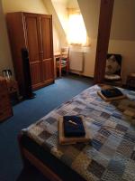 Postel nebo postele na pokoji v ubytování Hotel U Zvonu