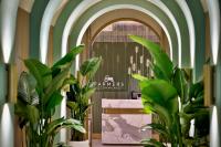 a room with green walls and plants and a counter at Hotel Local Dubai, Jumeirah Village Triangle, Autograph Collection in Dubai