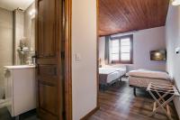 Postel nebo postele na pokoji v ubytování Hotel SNÖ Mont Romies