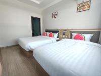 Beijing Watermelon Journey Hotel - Daxing Airportにあるベッド