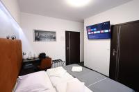 Telewizja i/lub zestaw kina domowego w obiekcie Hotel Junior