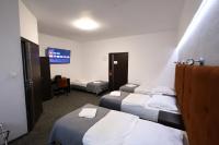 Łóżko lub łóżka w pokoju w obiekcie Hotel Junior