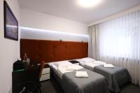 Łóżko lub łóżka w pokoju w obiekcie Hotel Junior