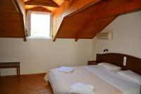 A bed or beds in a room at Red Rose Garden
