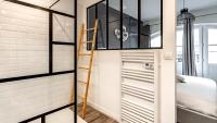 Łóżko lub łóżka w pokoju w obiekcie L'Escapade Urbaine - Cosy et central