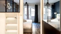 Łóżko lub łóżka w pokoju w obiekcie L'Escapade Urbaine - Cosy et central