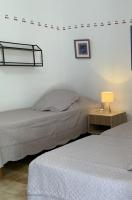 Łóżko lub łóżka w pokoju w obiekcie Gîte La loge 142 route de CARPENTRAS 84210 VENASQUE