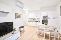 a kitchen and dining room with a table and chairs at appartamento fronte mare in Pescara