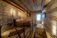 Postel nebo postele na pokoji v ubytování Chelebi Cave House