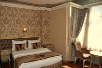 Postel nebo postele na pokoji v ubytování Kaftan Hotel