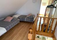 Łóżko lub łóżka w pokoju w obiekcie Tumidaj Cottage