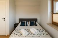 Posteľ alebo postele v izbe v ubytovaní Apartamenty u Moni