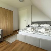 Posteľ alebo postele v izbe v ubytovaní Apartamenty u Moni