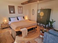 Een bed of bedden in een kamer bij De Pingerhoeve