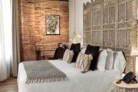 A bed or beds in a room at Hotel La Casa de Los Mosaicos