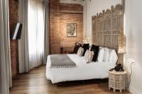 A bed or beds in a room at Hotel La Casa de Los Mosaicos