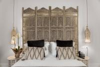 A bed or beds in a room at Hotel La Casa de Los Mosaicos