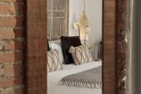 A bed or beds in a room at Hotel La Casa de Los Mosaicos