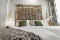 A bed or beds in a room at Hotel La Casa de Los Mosaicos