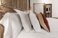 A bed or beds in a room at Hotel La Casa de Los Mosaicos