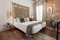 A bed or beds in a room at Hotel La Casa de Los Mosaicos