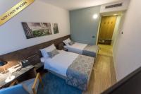 Posteľ alebo postele v izbe v ubytovaní Hotel Jarun