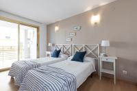 Postel nebo postele na pokoji v ubytování UHC Novelty Apartments