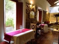 a dining room with two tables and a window at Casal da Serrana in Óbidos