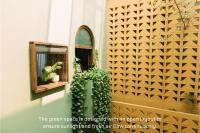 a green space is designed with an open layout to ensure sunlight and fresh air flow at Deja Vu House Ha Long in Ha Long