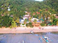 an aerial view of a beach with a resort at Suites by Eco Hotels in El Nido