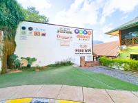 a building with a free wifi sign in front of it at Suites by Eco Hotels in El Nido