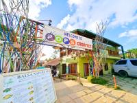 a building with a sign in front of it at Suites by Eco Hotels in El Nido