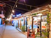 an empty street at night with a store at Suites by Eco Hotels in El Nido