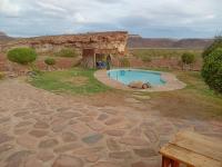a small swimming pool in the middle of a field at Hais Ra Tented Campsite in Khorixas